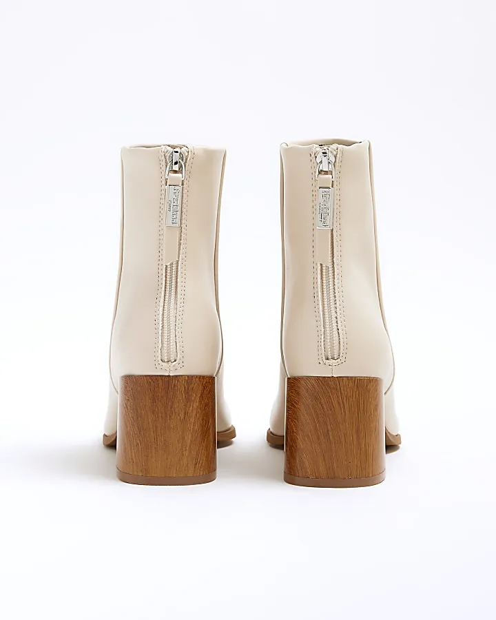 Cream block heeled ankle boots