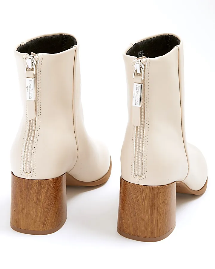 Cream block heeled ankle boots